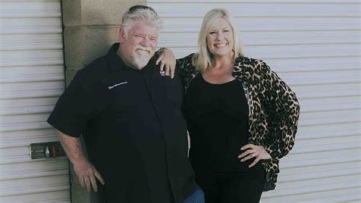 Dan Dotson from 'Storage Wars' standing in front of a storage locker