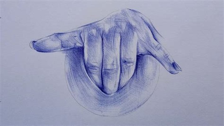 drawing on hand with pen
