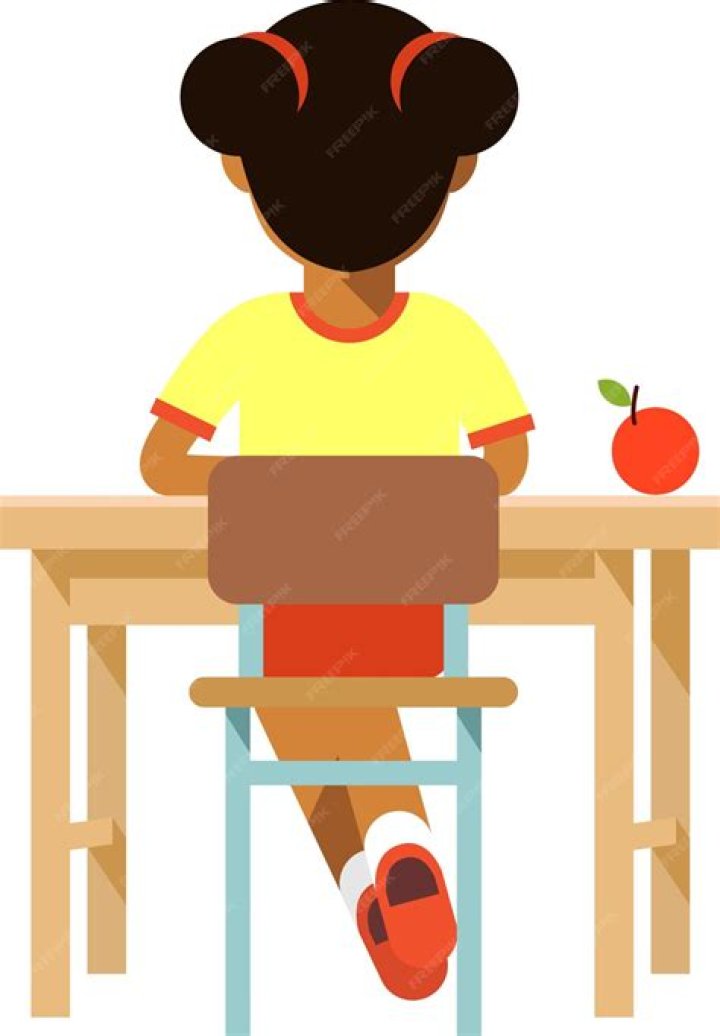 girl sitting backward on school chair