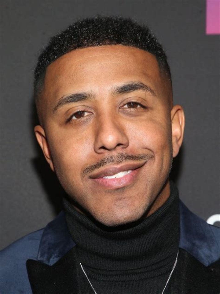 Singer Marques Houston and his wife, Miya Dickey (L). Marques squatting next to a brick wall (R)